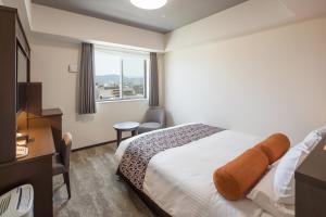 Postel nebo postele na pokoji v ubytování HOTEL MYSTAYS Kyoto Shijo