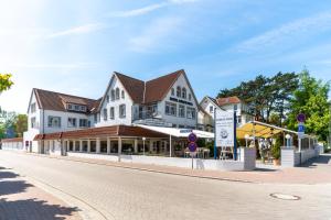 a building on the side of a street at Hotel Gorch Fock in Timmendorfer Strand