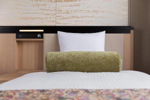 Postel nebo postele na pokoji v ubytování HOTEL MYSTAYS Kyoto Shijo