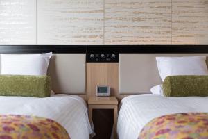 Postel nebo postele na pokoji v ubytování HOTEL MYSTAYS Kyoto Shijo