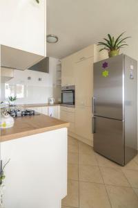 Kuchyň nebo kuchyňský kout v ubytování Apartment Mamma Mia