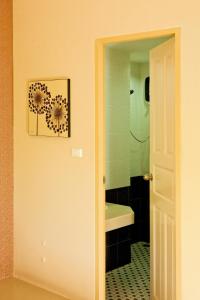 a bathroom with a sink and a mirror at Mellow Space Boutique Rooms in Karon Beach