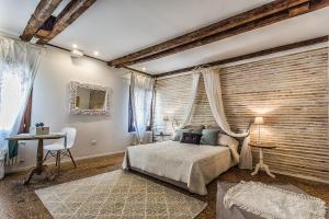 a bedroom with a bed and a wooden wall at Venice Dream House in Venice