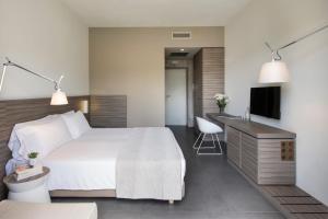 A bed or beds in a room at Hotel & Resort Le Colombare