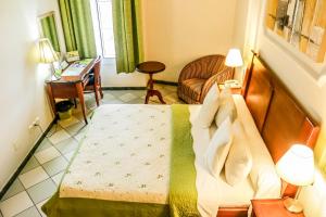 Katil atau katil-katil dalam bilik di Tchero Hotel