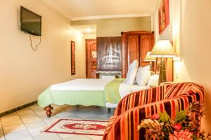Katil atau katil-katil dalam bilik di Tchero Hotel