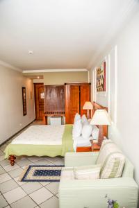 Katil atau katil-katil dalam bilik di Tchero Hotel