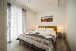 Posteľ alebo postele v izbe v ubytovaní Solin apartments Praetorium