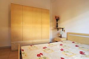 a bedroom with a bed with flowers on it at Silville in Silvi Marina