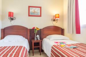 Ein Bett oder Betten in einem Zimmer der Unterkunft Résidence Pierre & Vacances Le Domaine de Gascogne