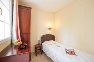 Ein Bett oder Betten in einem Zimmer der Unterkunft Résidence Pierre & Vacances Le Domaine de Gascogne