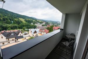 a balcony with a view of a city at Przy Deptaku in Krynica Zdrój