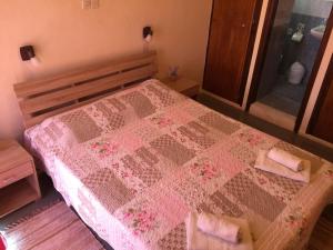 A bed or beds in a room at Platanos Rooms