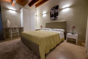 Postel nebo postele na pokoji v ubytování Domus Hyblaea Resort