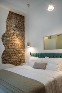 A bed or beds in a room at Bahar Boutique Hotel