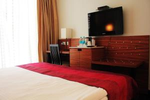 Postel nebo postele na pokoji v ubytování Hotel Ivory 32