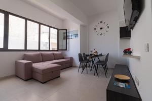 a living room with a couch and a table at Apartamentos Bello Lanzarote in Arrecife