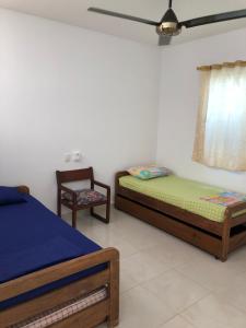 מיטה או מיטות בחדר ב-Casa de Playa Manecal
