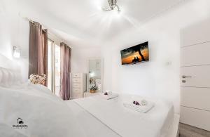 Ένα ή περισσότερα κρεβάτια σε δωμάτιο στο Kings Towers Apartments