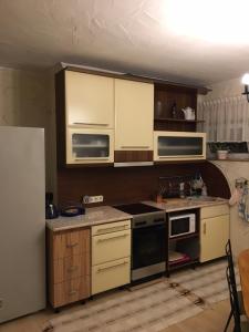 Η κουζίνα ή μικρή κουζίνα στο Tocc Apartman