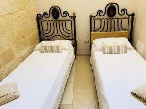 Postel nebo postele na pokoji v ubytování Borgo in corte