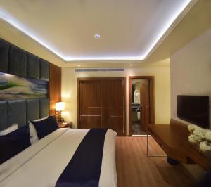 Letto o letti in una camera di Gems Hotel