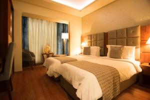Letto o letti in una camera di Gems Hotel