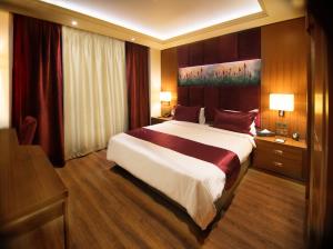 Letto o letti in una camera di Gems Hotel