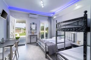 a bedroom with a bunk bed and a dining room at A Ponte Studios & Apartments in Sykia Chalkidikis +37 photos