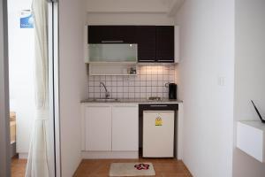 Kuchyň nebo kuchyňský kout v ubytování Avatara Condo B24 by malai