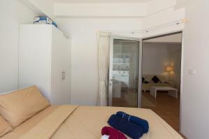 Postel nebo postele na pokoji v ubytování Avatara Condo B24 by malai + 37 fotografií