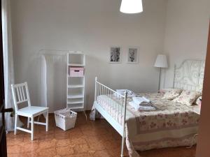 Katil atau katil-katil dalam bilik di Villa Palmina