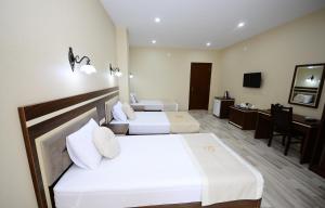 Postel nebo postele na pokoji v ubytování Hotel 725 B