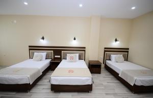 Postel nebo postele na pokoji v ubytování Hotel 725 B