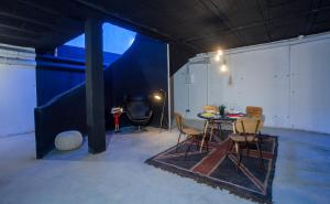 a room with a table and chairs in it at La Casita de la Planta in Quintanilla de Onésimo +42 photos