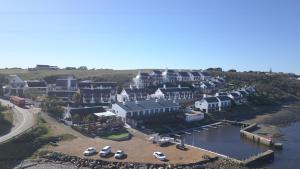an aerial view of a large house with a marina at Breede River Lodge in Witsand