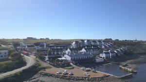 an aerial view of a town with a harbor at Breede River Lodge in Witsand