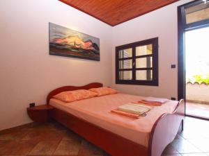 Posteľ alebo postele v izbe v ubytovaní Apartments Nenad 1720
