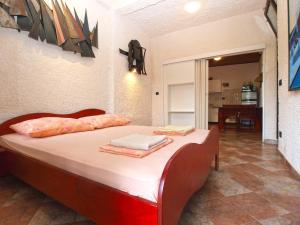 Posteľ alebo postele v izbe v ubytovaní Apartments Nenad 1720
