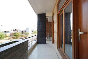 a balcony of a building with a view of a city at Stay @ 203 in Noida