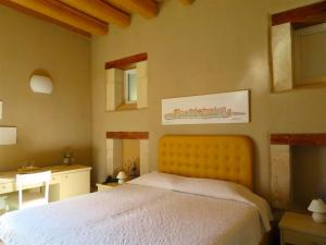 Hotel Casale Milocca客房内的一张或多张床位