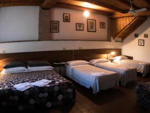 Voodi või voodid majutusasutuse Locanda Casa Motta toas