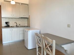 Kuchyň nebo kuchyňský kout v ubytování Kimata Apartments
