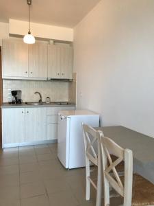 Kuchyň nebo kuchyňský kout v ubytování Kimata Apartments