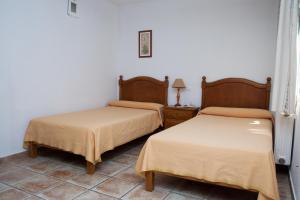 Postel nebo postele na pokoji v ubytování Hostal El Rincón + 21 fotografií