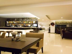 The lounge or bar area at The Dawin Hotel