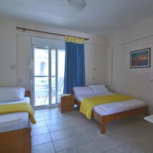 Postel nebo postele na pokoji v ubytování Hotel Nestor