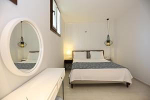 a bedroom with two beds and a mirror at Alp Suites Pinehill in Akyaka +33 photos
