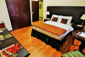 Postel nebo postele na pokoji v ubytování Hotel San Fernando Real