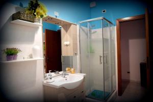 a bathroom with a sink and a shower at Angulum in Citta' Sant'Angelo +59 photos